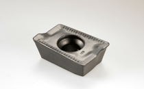 ADKT 1505PDTR-76 IC910-HELIMILL general use milling insert with reinforced helical cutting edges and ribs on the rake face to reduce heat transfer. Used for interrupted cuts and heavy machining.